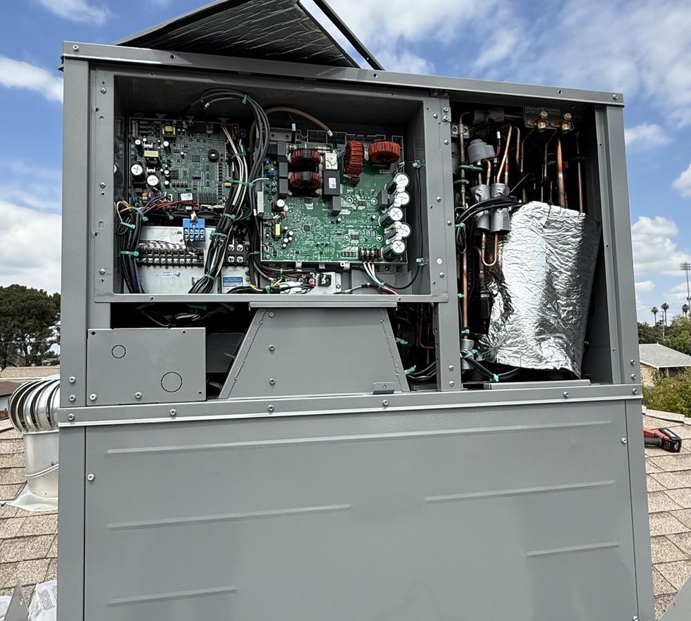 Infinity Air technician servicing a rooftop HVAC unit