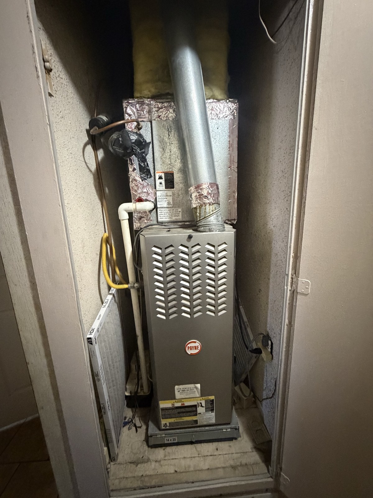 Gas furnace installed in a utility closet