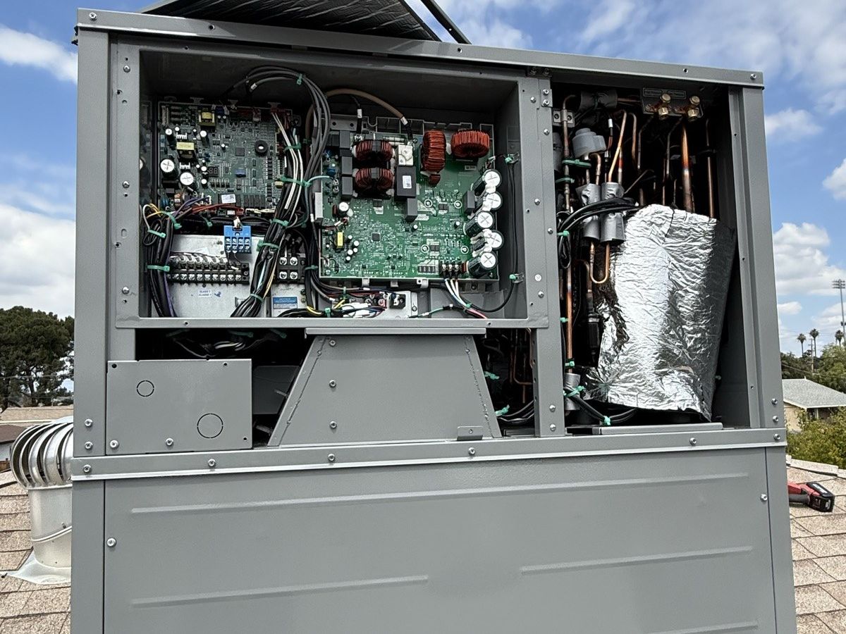Rooftop HVAC unit opened for service